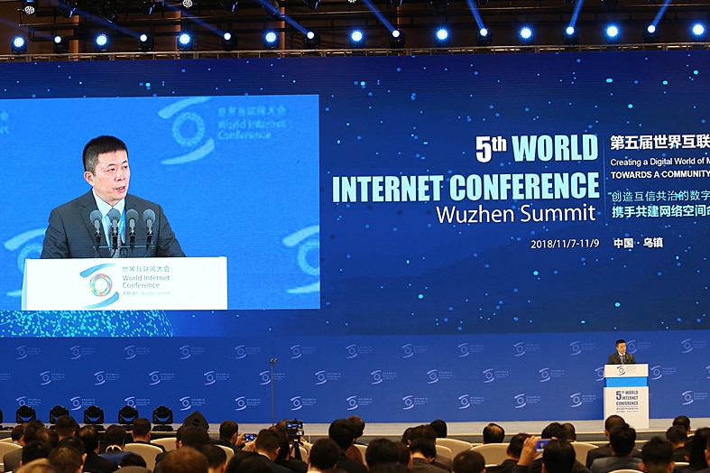 A Chinese man is giving speech in front of a giant LED display on the 5th World Internet Conference in WuZhen, China.