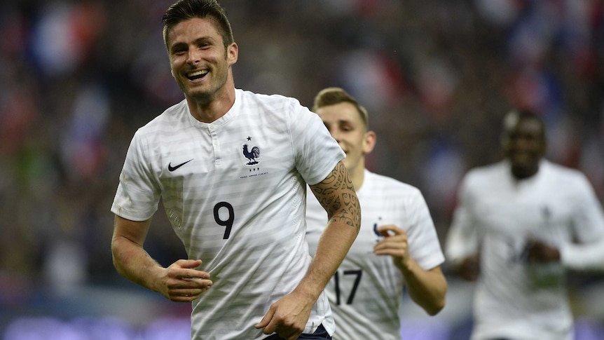 Olivier Giroud celebrates scoring for France