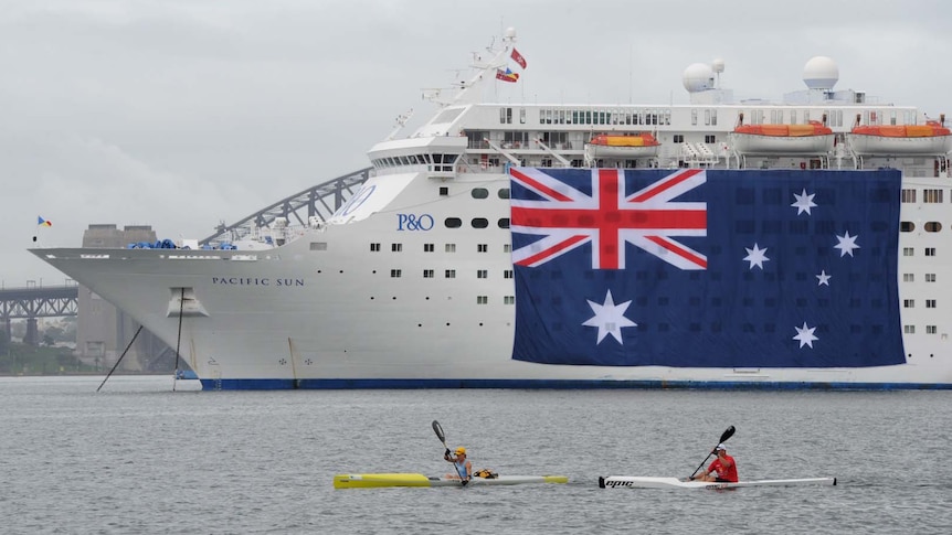 Australian flag is displayed on a cruise ship on Sydney Harbour