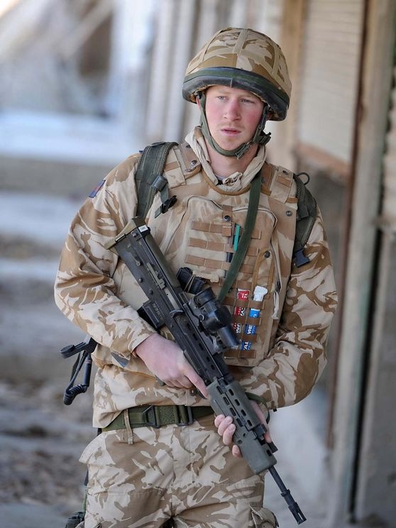 Britain's Prince Harry patrols through the deserted town of Garmisir