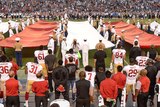 Colin Kaepernick kneels during the national anthem