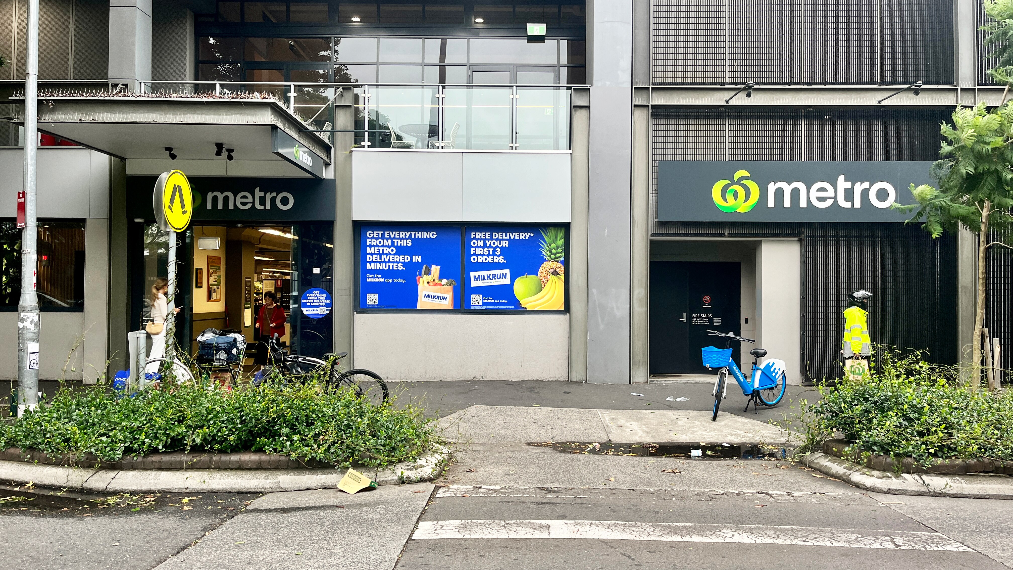 The exterior of a Woolworths Metro store in Redfern, Sydney, with Milkrun advertising on the exterior. 