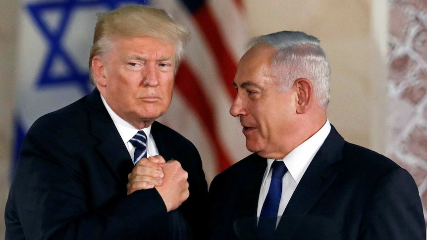US President Donald Trump shakes hands with Israel's Benjamin Netanyahu