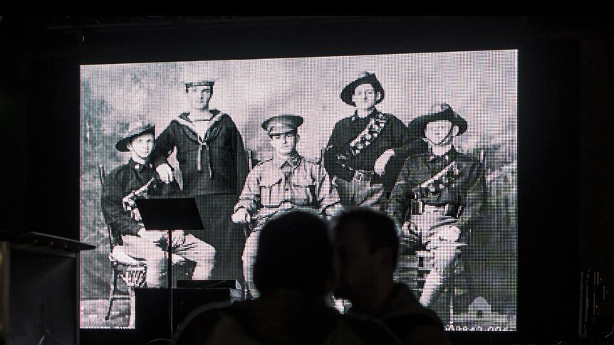LED screens displaying soldiers at a dawn service in Newcastle on Anzac Day 2014