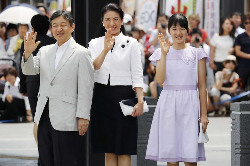 Naruhito, Masako and Aiko waving