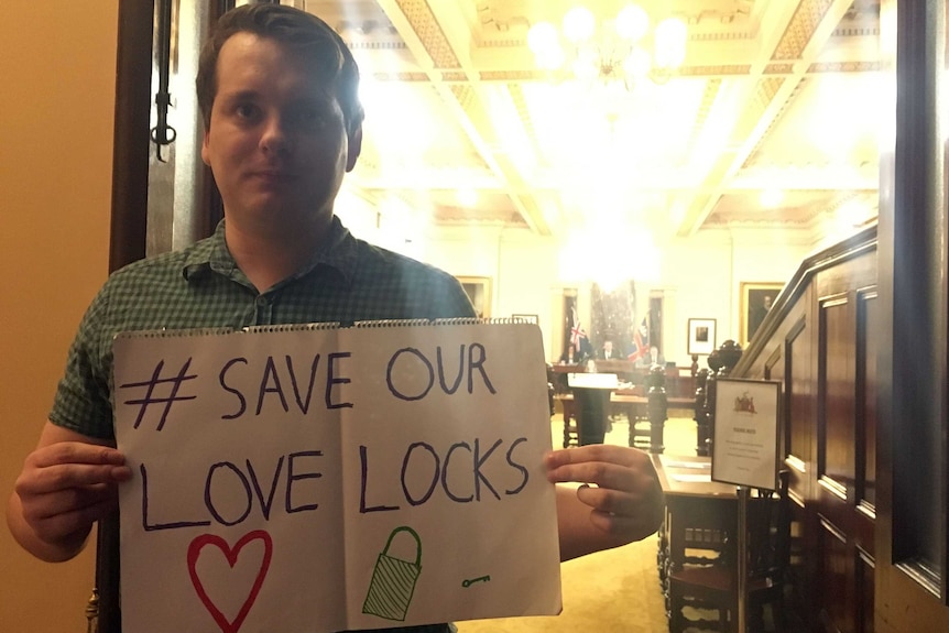 Keiran Snape with save the love locks sign.