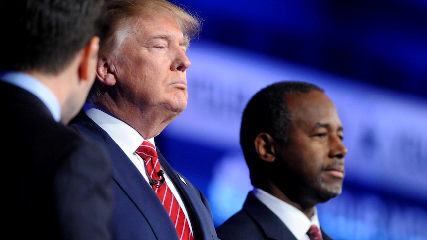 Donald Trump and Dr Ben Carson pause for a photo before the start of the debate.