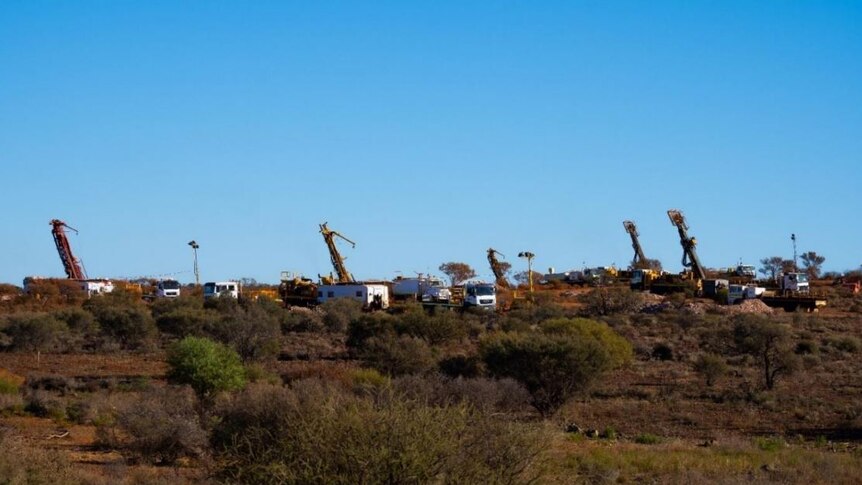 Drill rigs exploring for gold in the outback