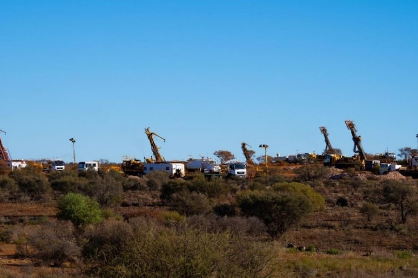 Drill rigs exploring for gold in the outback