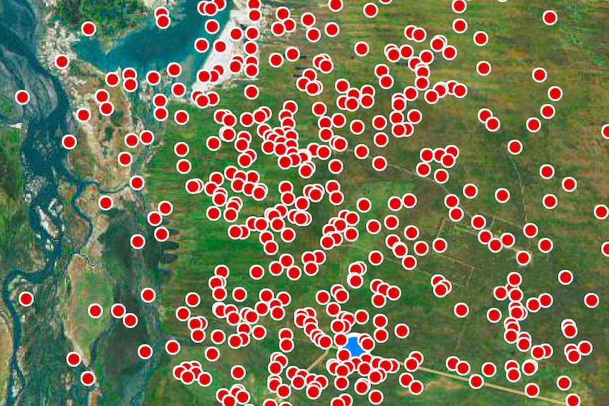 A satellite image showing a number of red dots surrounding the blue dot