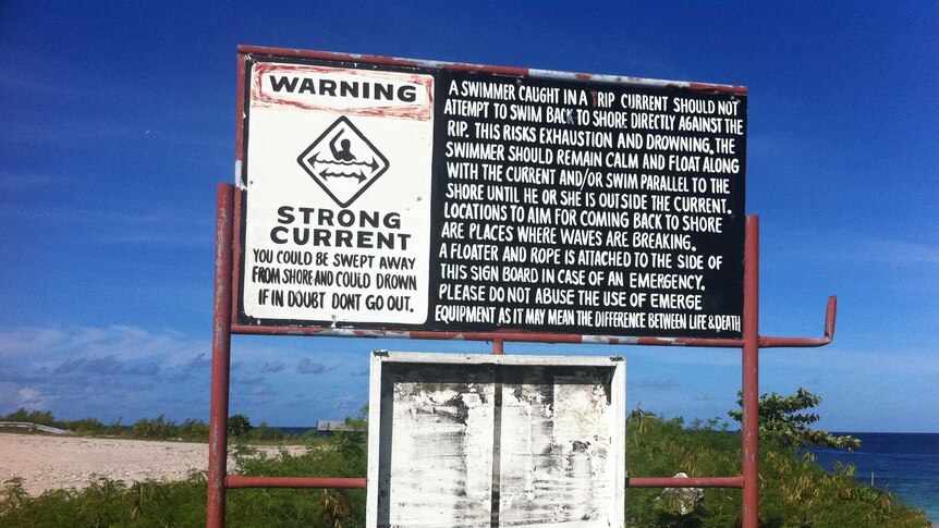 A sign warning swimmers of strong currents is seen on Nauru