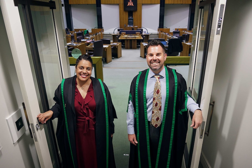 Chansey Paech and Ngaree Ah Kit open the doors of NT Parliament with broad smiles.