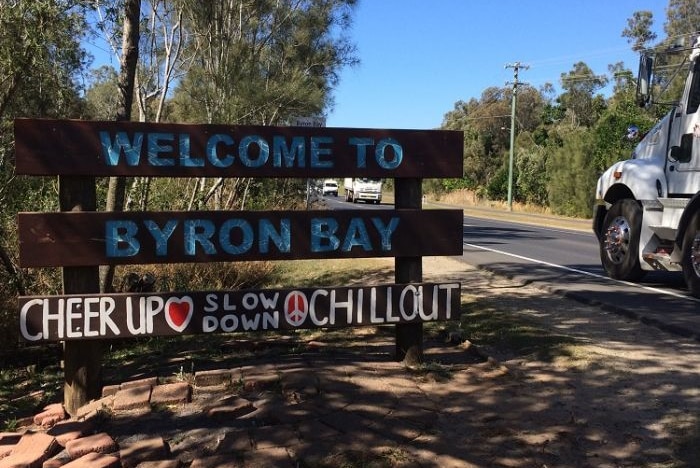 A roadside sign tells visitors to Byron Bay to "chill out".