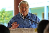 Samoan Prime Minister Tuilaepa Sailele Malielegaoi speaks at a lectern