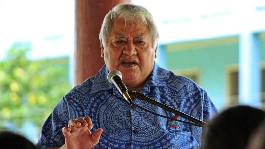 Samoan Prime Minister Tuilaepa Sailele Malielegaoi speaks at a lectern