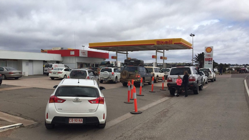 Cars queue at petrol station