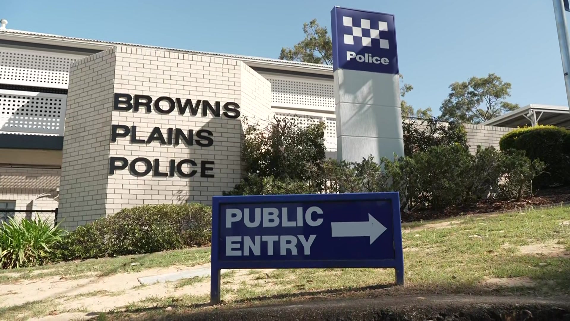 Browns Plains police station with a blue sign in front which says "public entry".
