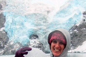 Elizabeth Allison holds glacial ice in Kenai Fjords National Park, Alaska.