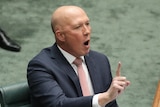 Peter Dutton holds one finger up while sitting in the house of representatives