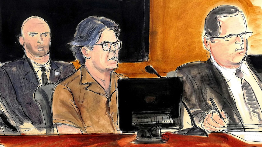 An artist's sketch shows Mr Raniere with his hair cut short surrounded by lawyers.