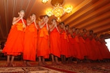 Members of Wild Boars soccer team pray during a ceremony marking the completion of their serving as novice Buddhist monks.