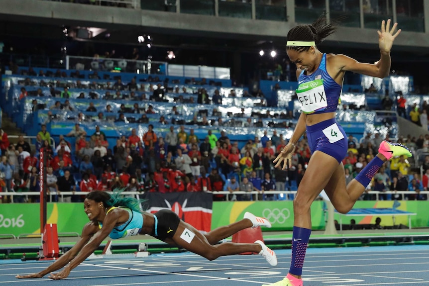 Bahamas' Shaunae Miller falls over the finish line in 400m final in Rio