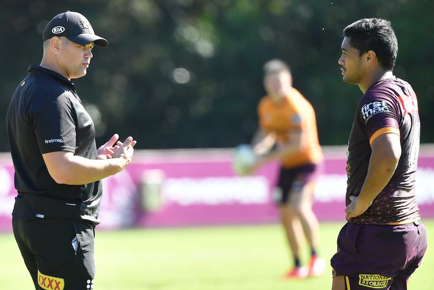 Brisbane Broncos coach Anthony Seibold speaks to player Anthony Milford at training.