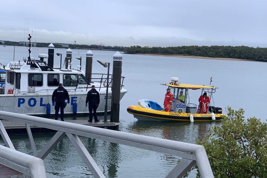 The coast guard returns from their search off North Stradbroke Island for a Chinese man.