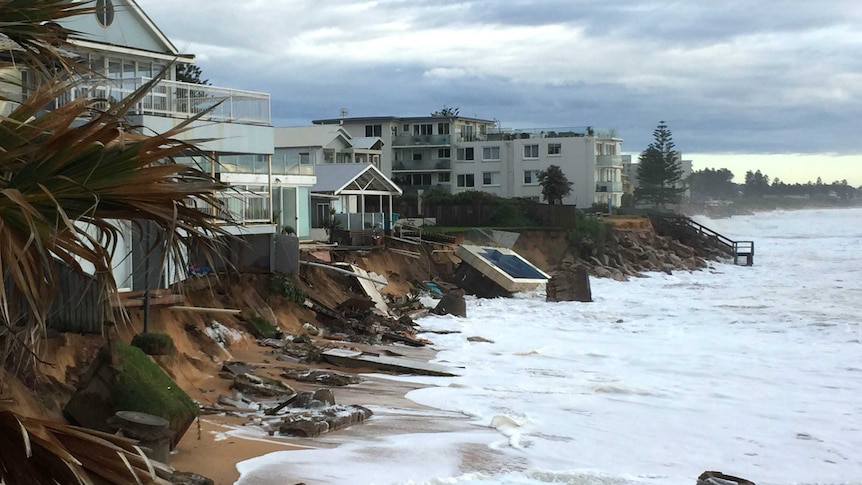 Damaged houses and collapsed swimming pool