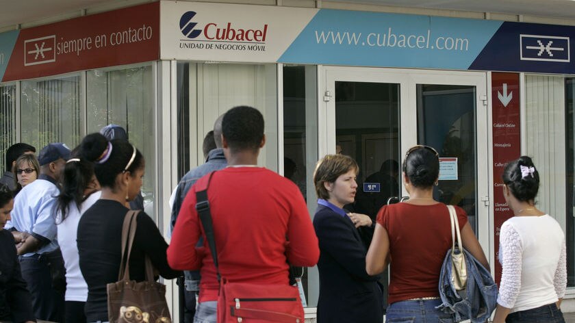 People line up outside a Cubacel mobile phone store in Havana on April 14, 2008.
