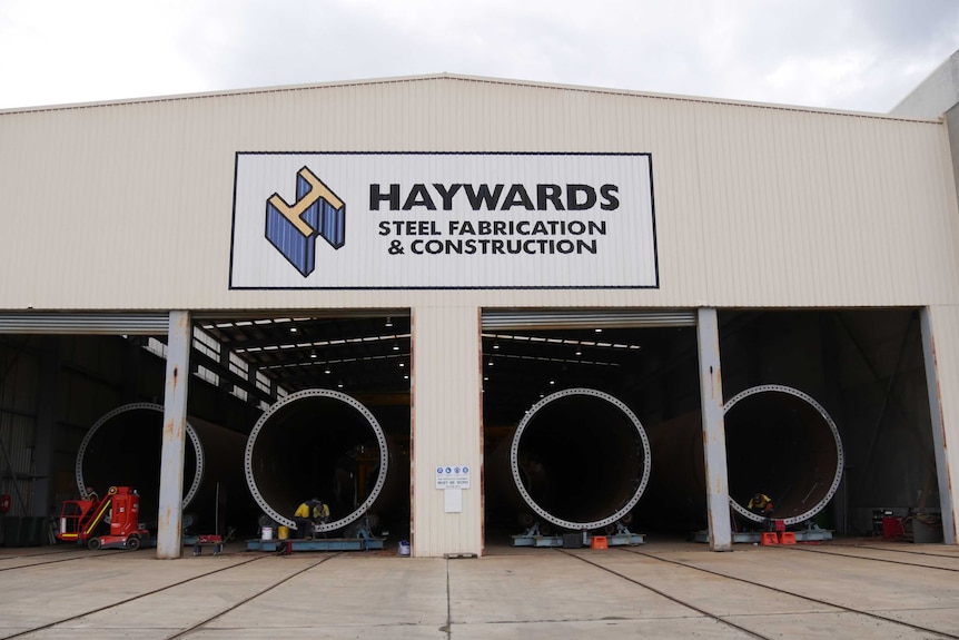 Wind turbine towers in shed.