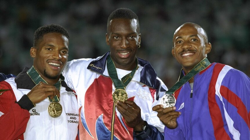 Familiar setting ... Frank Fredericks (R) on the medal podium with Michael Johnson (C) and Ato Boldon in Atlanta