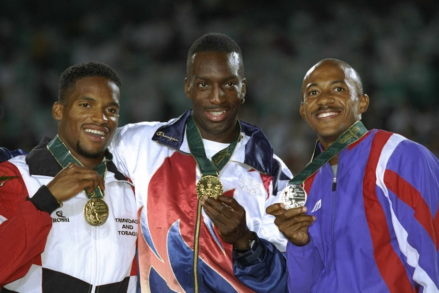 Familiar setting ... Frank Fredericks (R) on the medal podium with Michael Johnson (C) and Ato Boldon in Atlanta