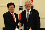 Andrew Robb and He Yoon Sang-jick