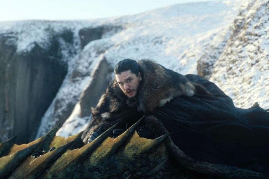 Jon Snow looks uncertain from atop a dragon.