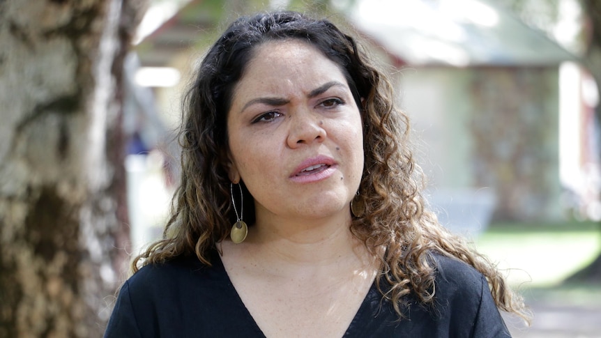 Aspiring federal politician Jacinta Price stands and looks concerned.