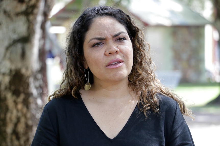 Aspiring federal politician Jacinta Price stands and looks concerned.