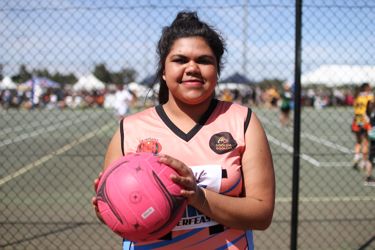 Kiesha McDonald, 20 from the Wotjobaluk Sisters from Horsham stands with a netball in her hands.