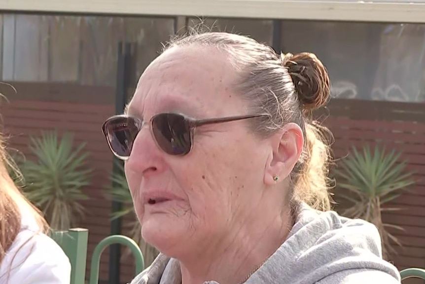 Debbie Cremen wearing sunglasses and a grey hoodie