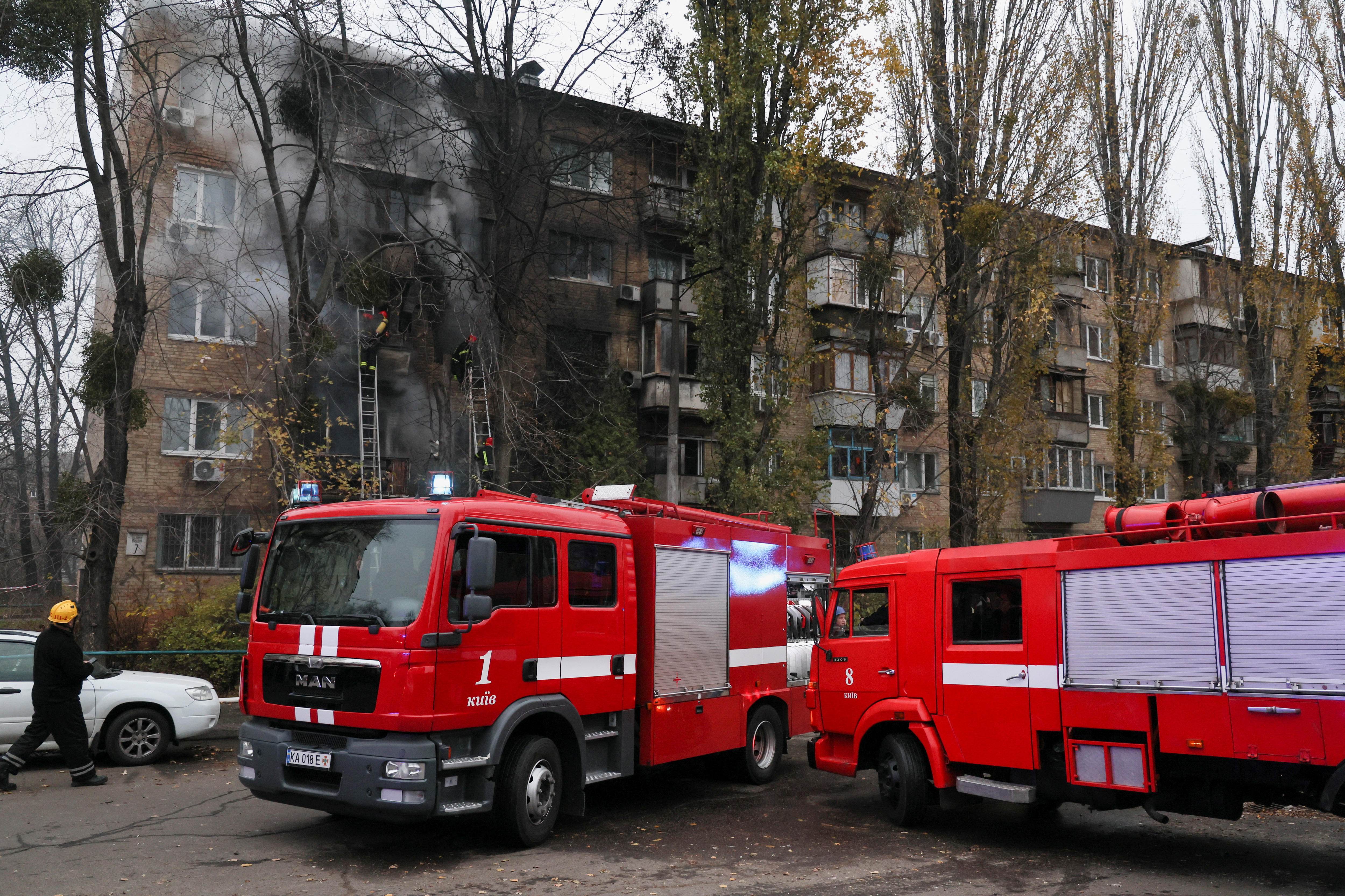 Firefighters work to put out a fire in a residential building.