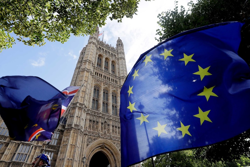 A European Union flag flies near Britain's Parliament.