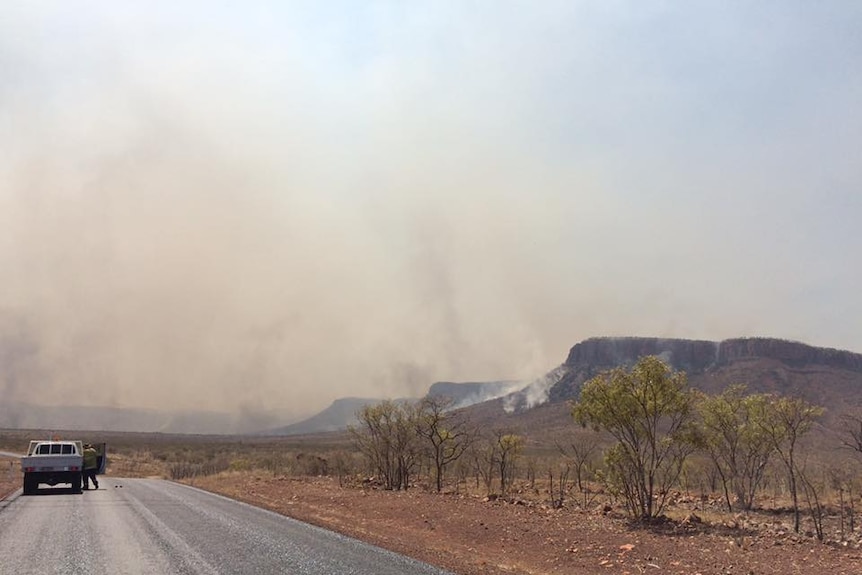 A photo of the Cockburn Ranges on fire in the East Kimberley