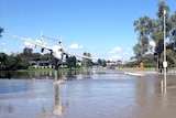 Floodwaters surround the De Havilland Vampire Jet in Lake Forbes Park.