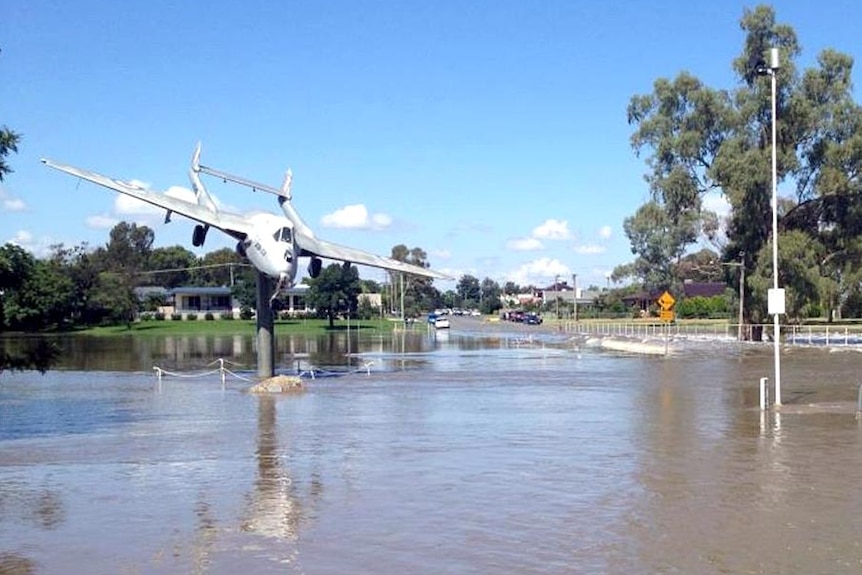 Floodwaters surround the De Havilland Vampire Jet in Lake Forbes Park.