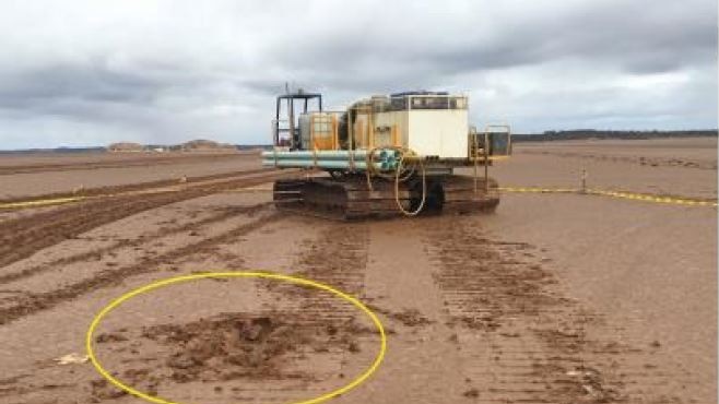 Drill rig on muddy salt lake