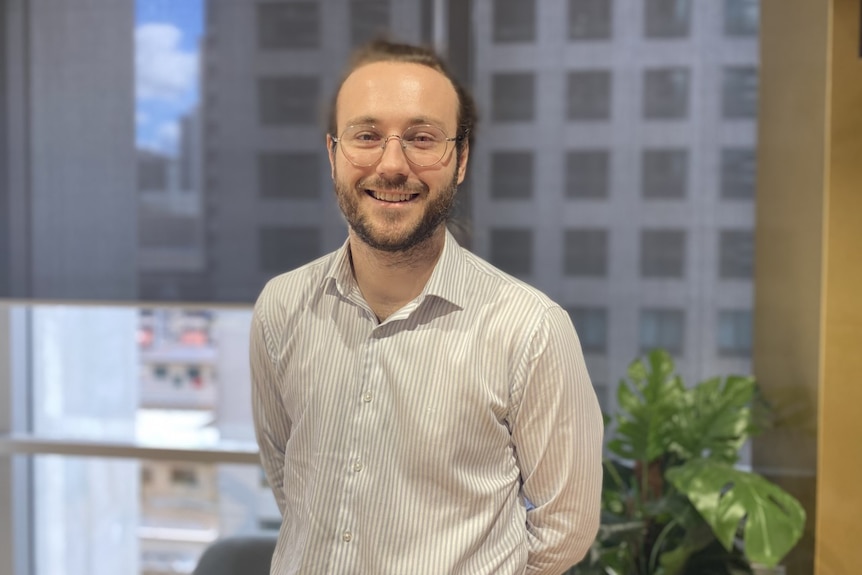 Jack smiles in an office.