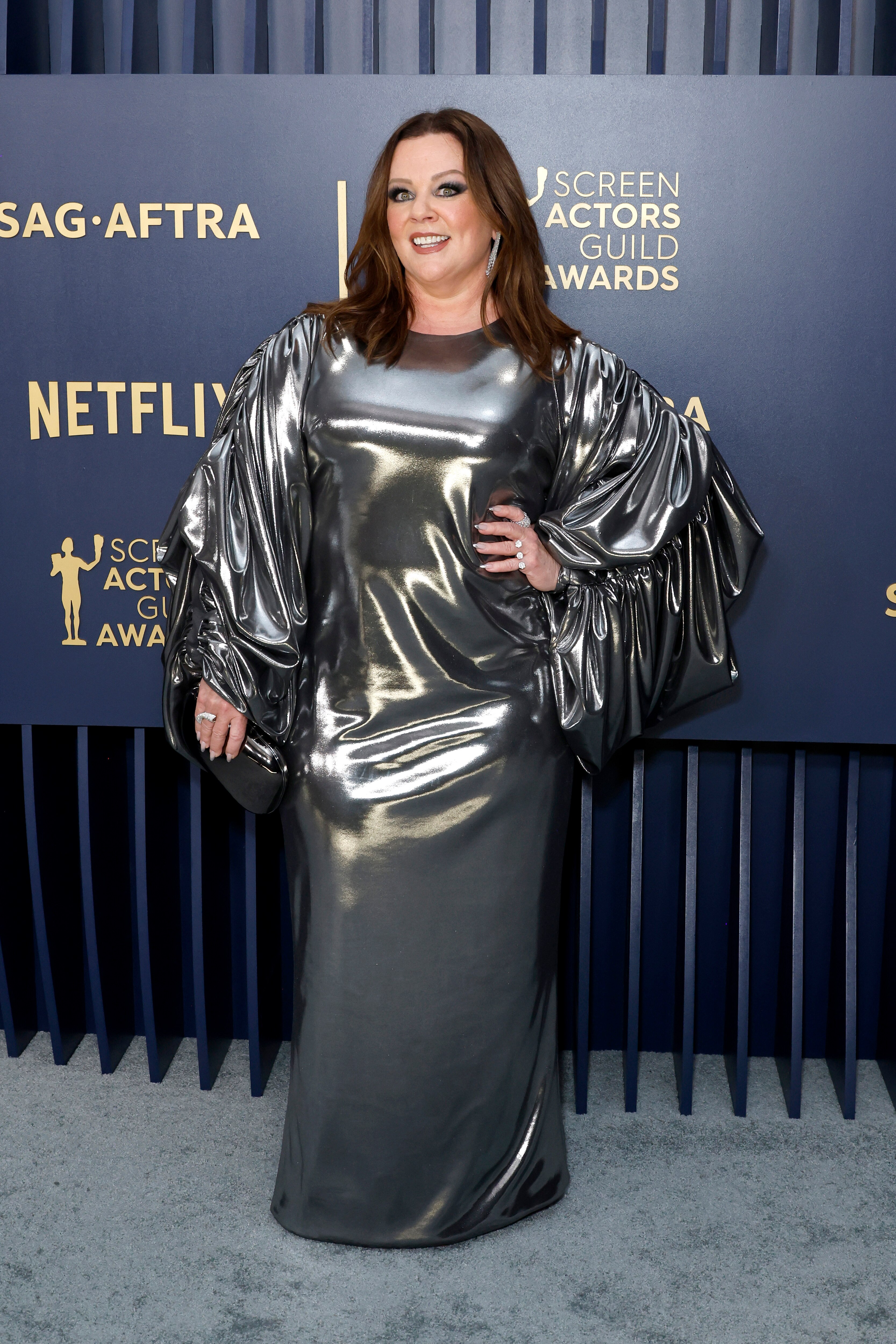 Person in a silver drape dress