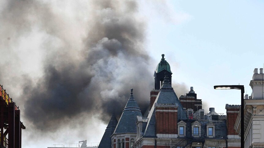Fire breaks out at London's 12-storey Mandarin Oriental Hotel (Photo: AP/John Stillwell)