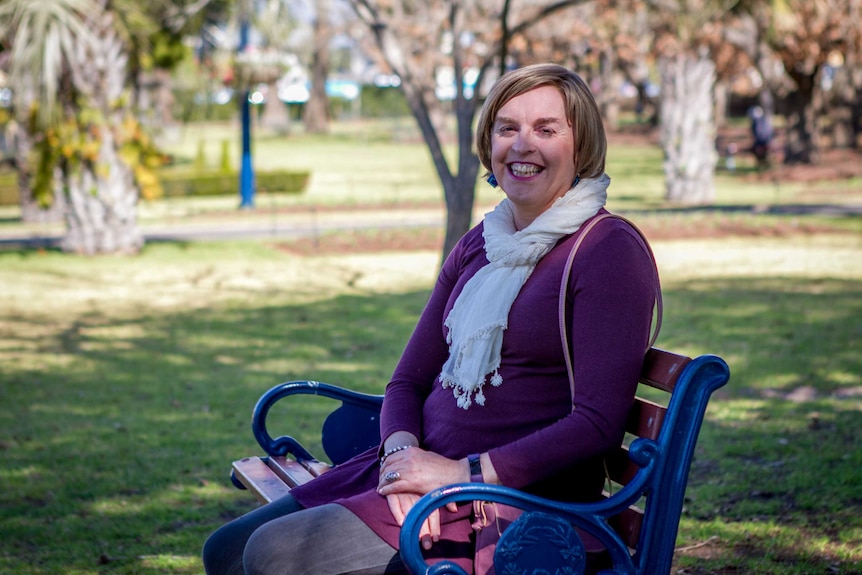 Jo sitting in a local park in Toowoomba in 2018.