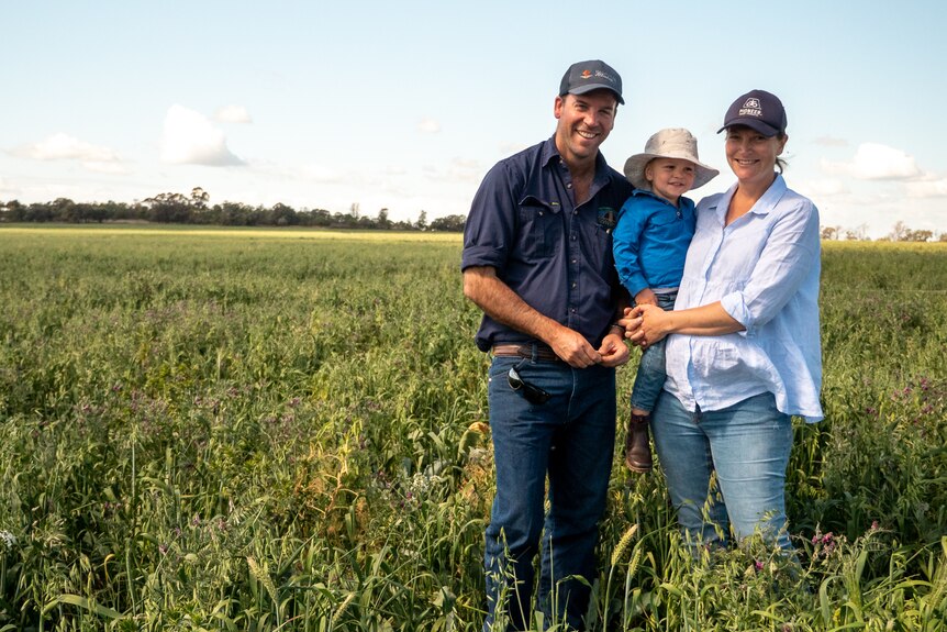 Dave and Alice Woods and their son James stand in the middle of a green, multi-species cover crop near Goondiwindi, August 2021.